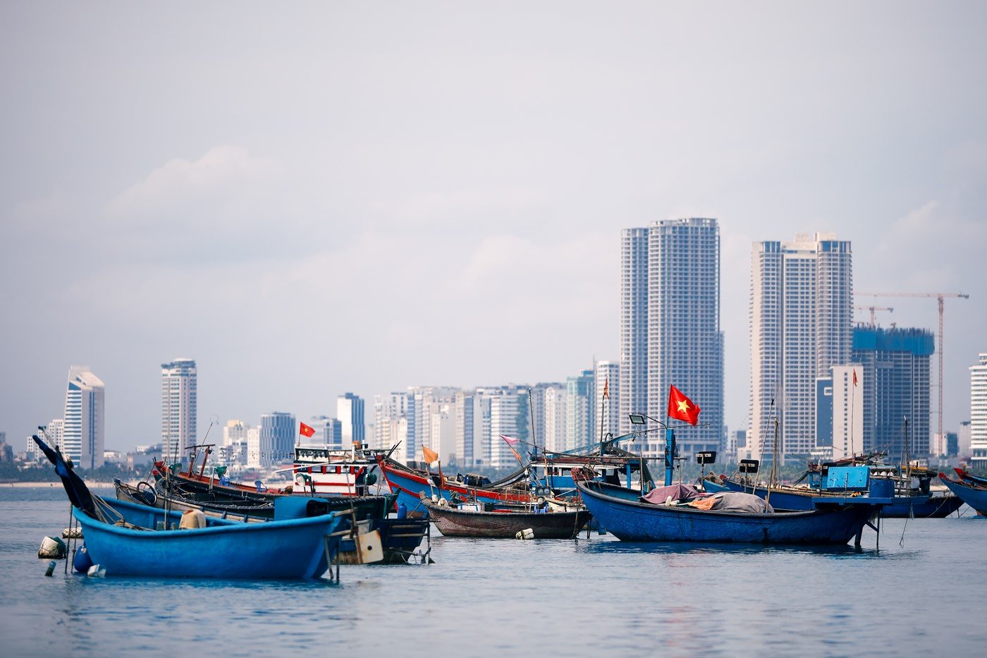 Vietnamese Flag On Fishing Boat Moored Against Urb 2023 11 27 05 08 33 Utc