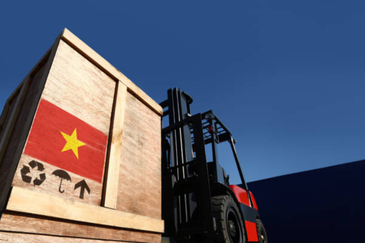 Cargo containers stacked at a Vietnamese port ready for export from Vietnam