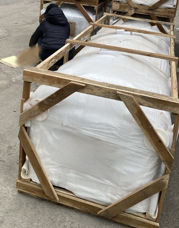 Biodegradable coffins prepared for international shipping with protective packaging