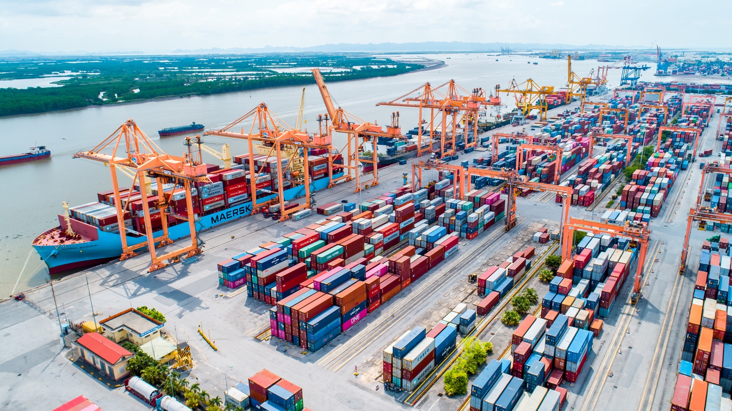 Haiphong port showing modern container handling equipment and shipping infrastructure