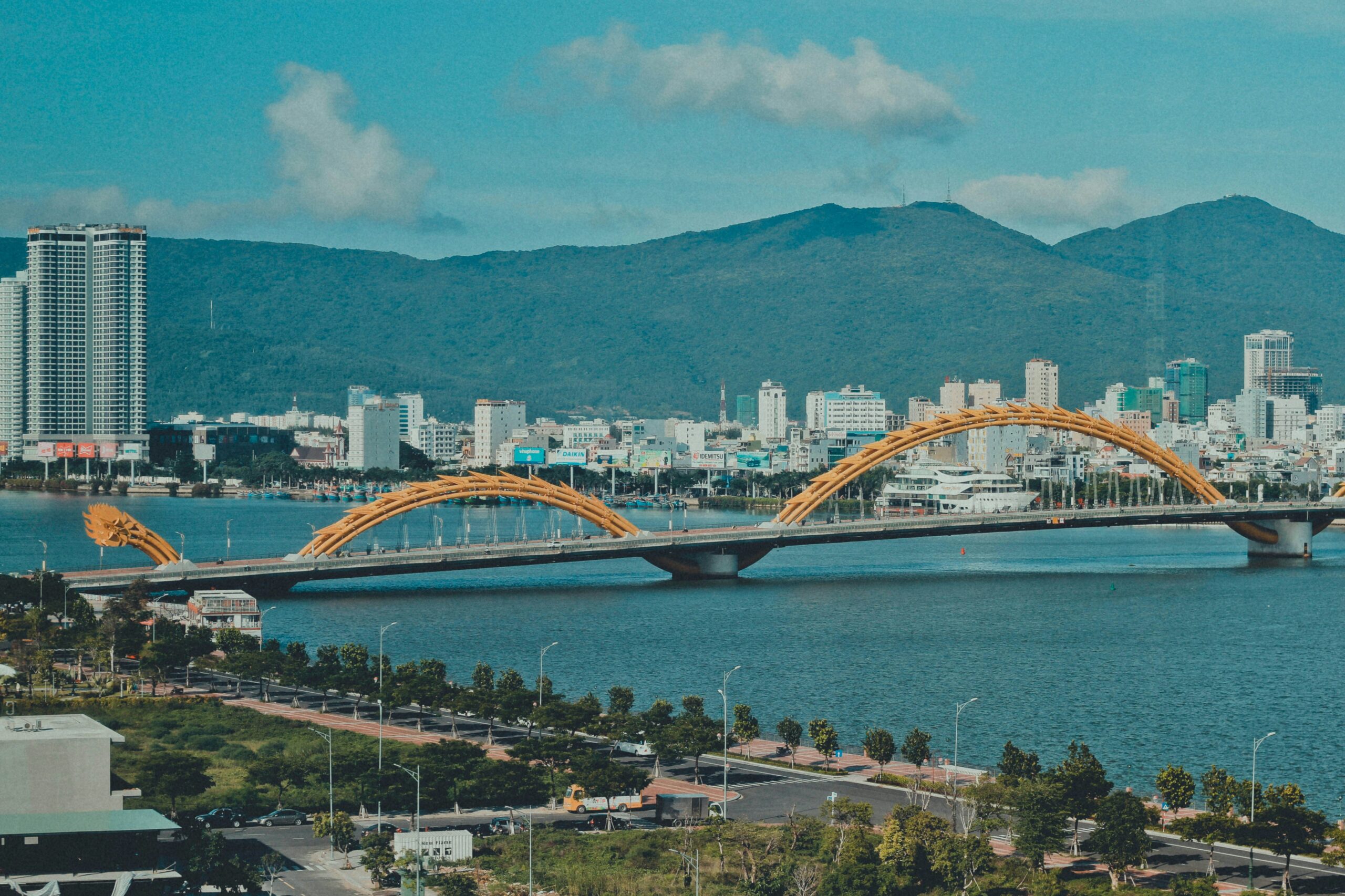 Da Nang showing modern city infrastructure with bridge and port facilities in the background