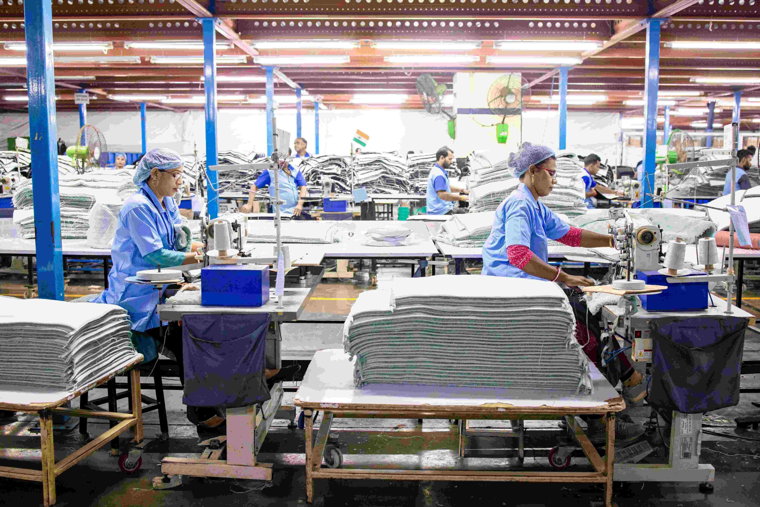 Textile workers in organized factory setting demonstrating labor standards and working conditions