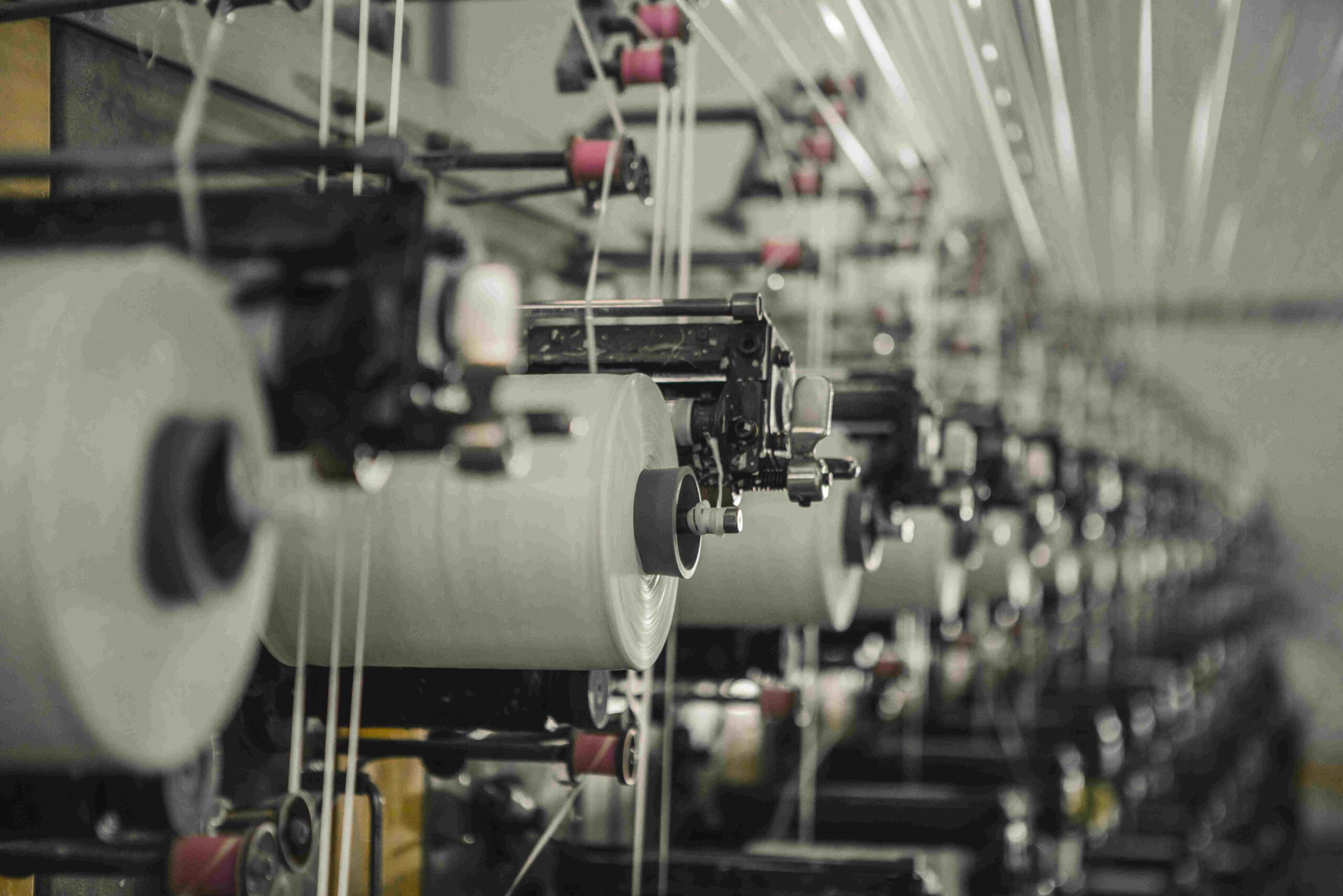 Textile spinning and weaving machinery showing production technology and automation level