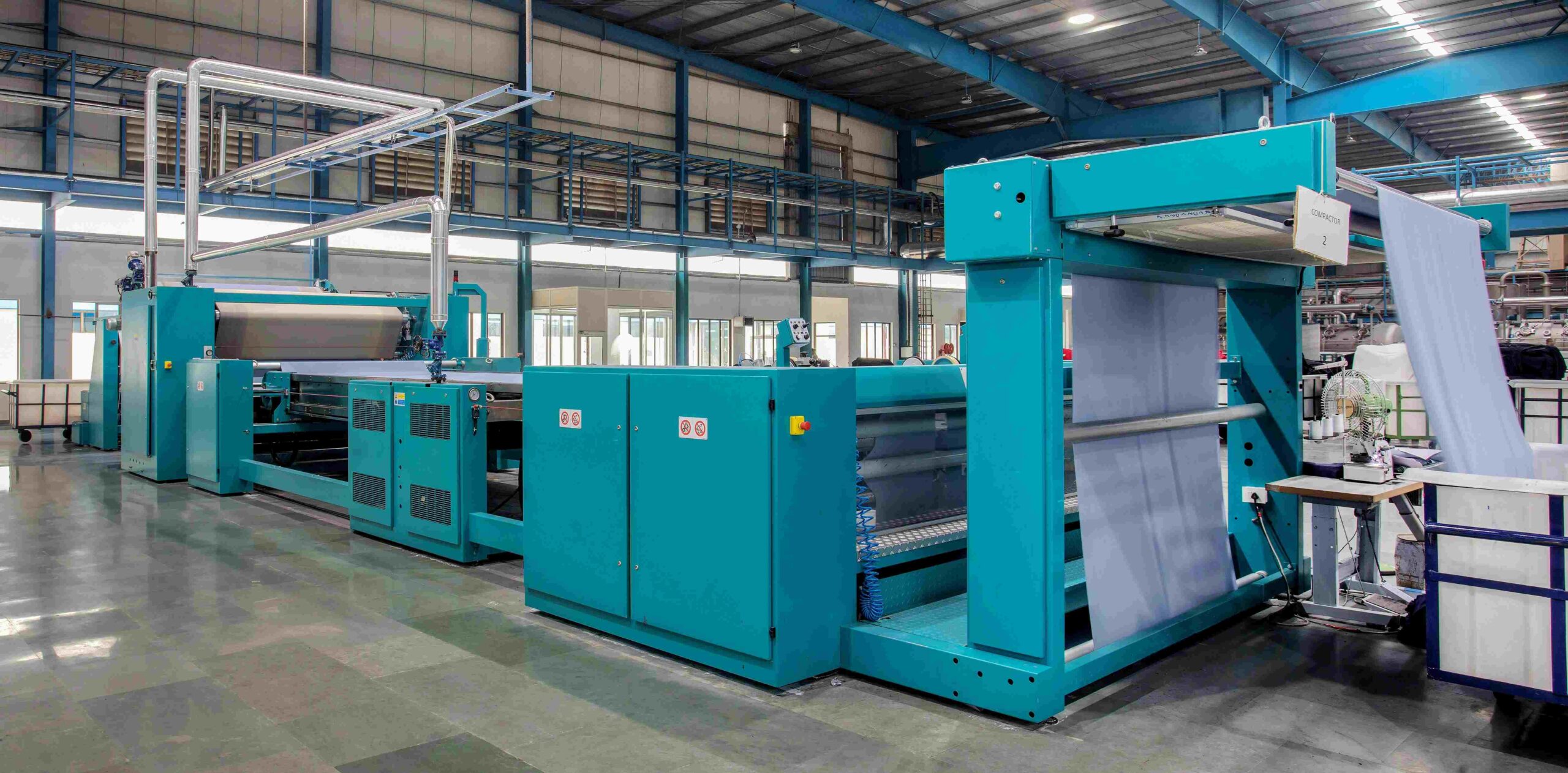 Modern textile manufacturing equipment showing automation, precision, and technological advancement