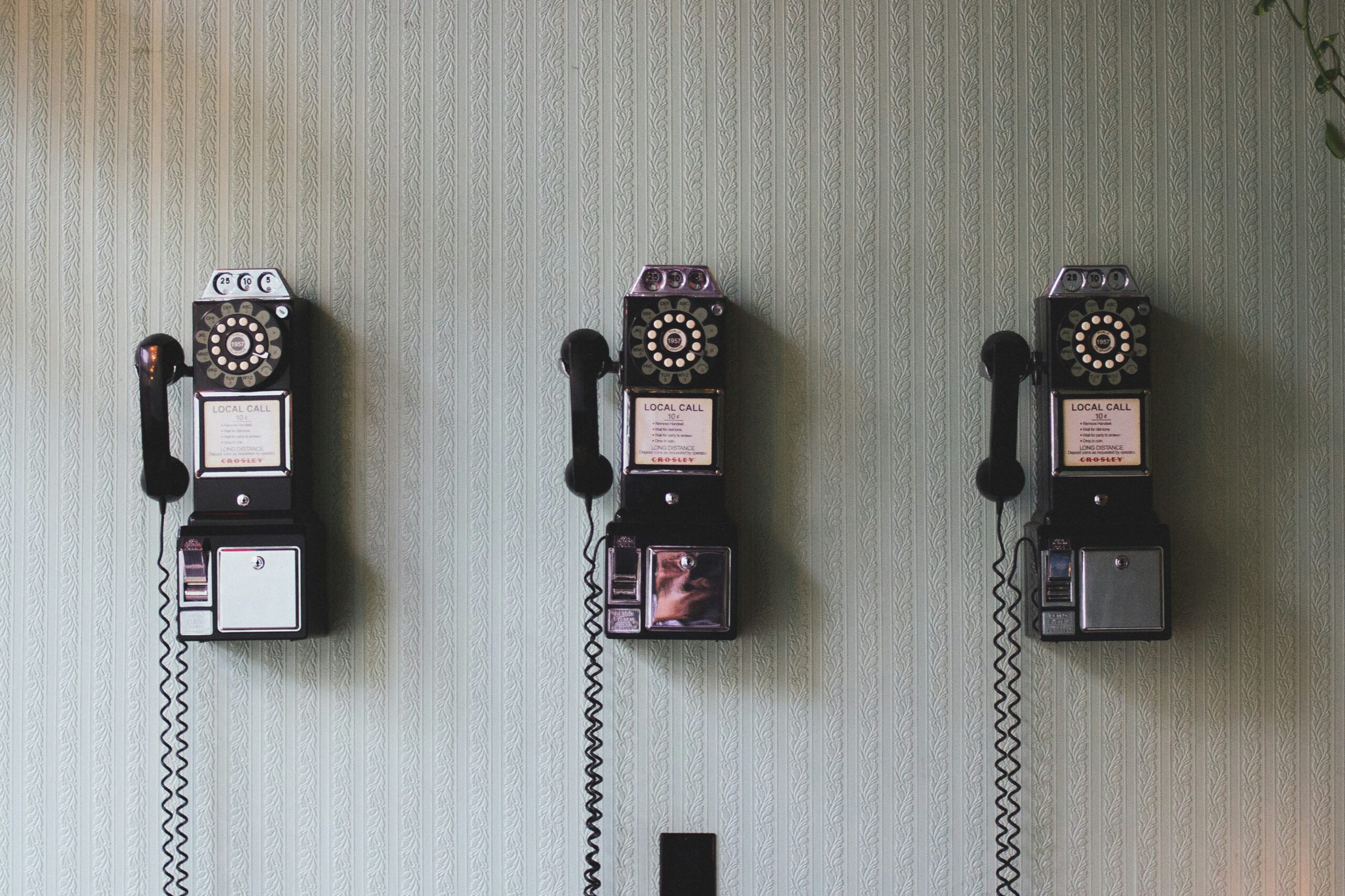 Row of vintage wall telephones, illustrating contact and communication for Vietnam-Australia trade agreement enquiries